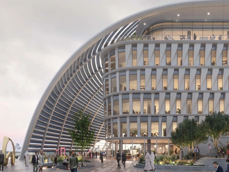 A futuristic, white multi-story office campus building.