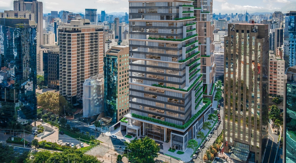 A modern high-rise building in a green city centre