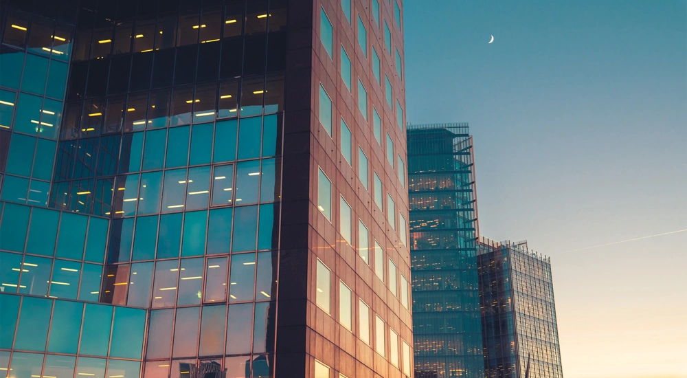 Glass skyscraper buildings at sunset