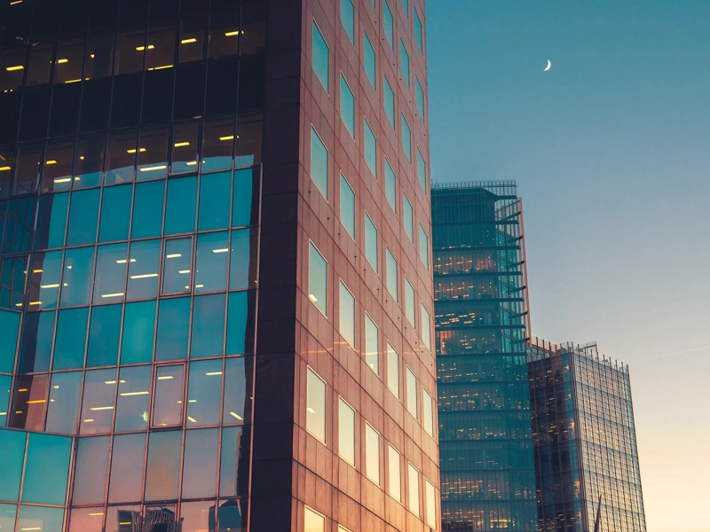 Glass skyscraper buildings at sunset