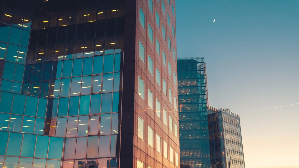 Glass skyscraper buildings at sunset