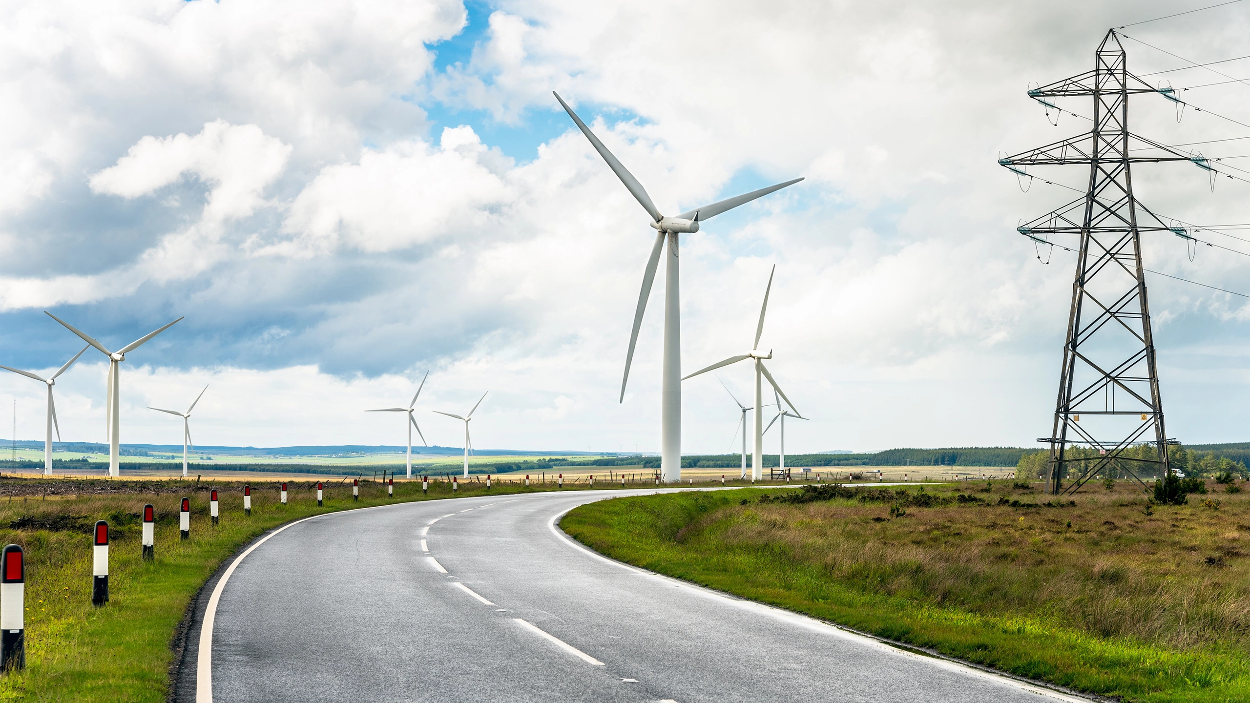 Pylons alongside a road in the UK 