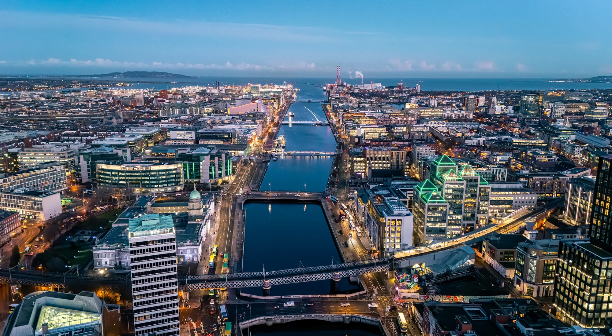Aerial view of busy city center buildings and traffic at night, Aerial view of the river Liffey and city center Dublin Ireland at night.