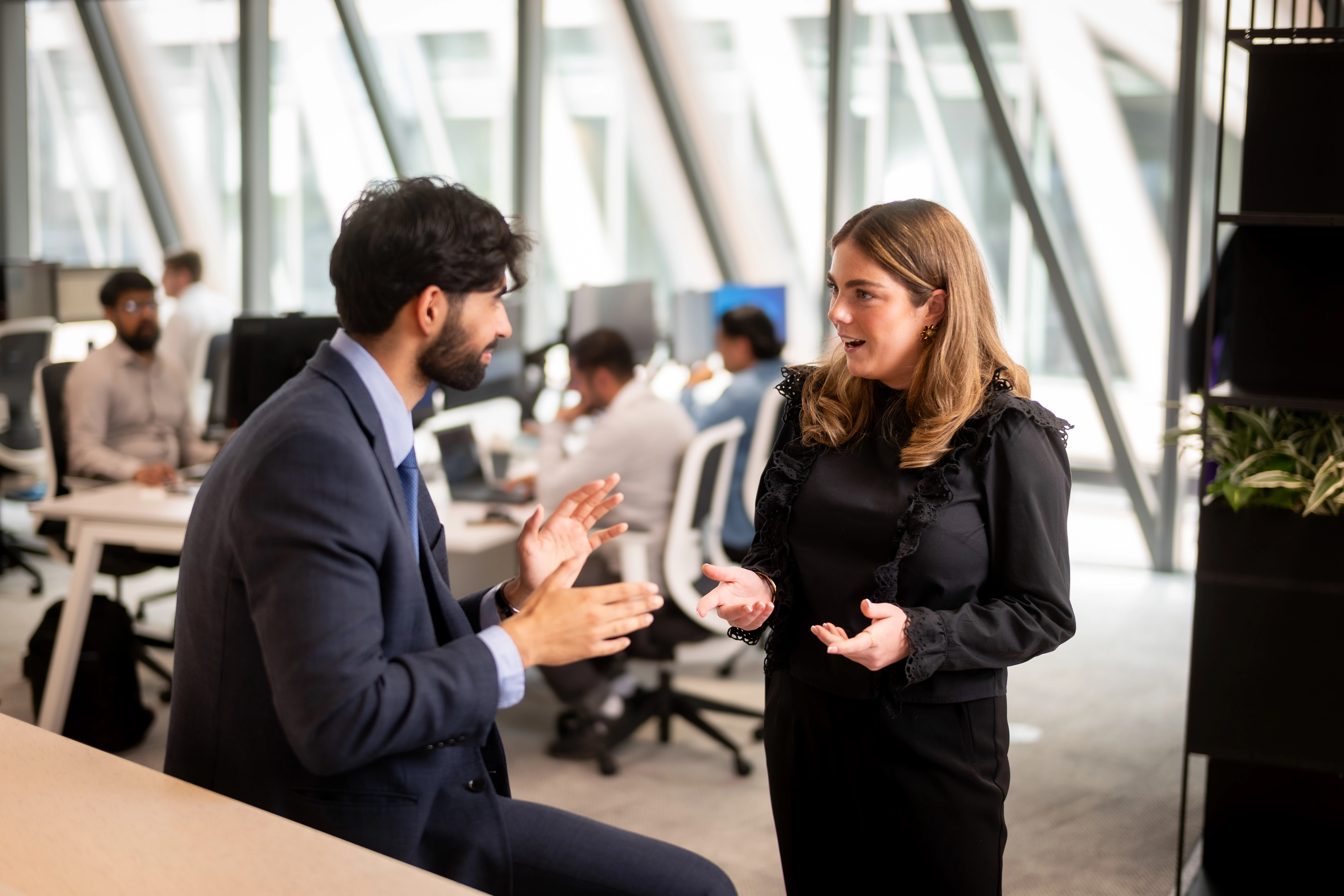 Employees talking in a modern office
