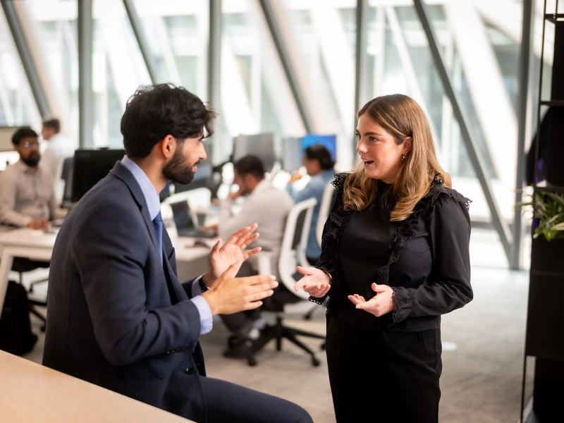 Employees talking in a modern office