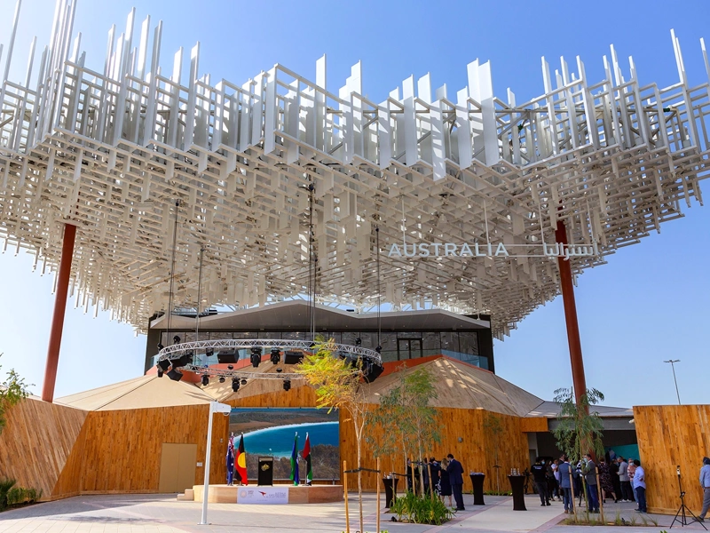 Exterior of the Australia Pavilion at Expo 2020 Dubai with wooden wall panelling and artistic white canopy