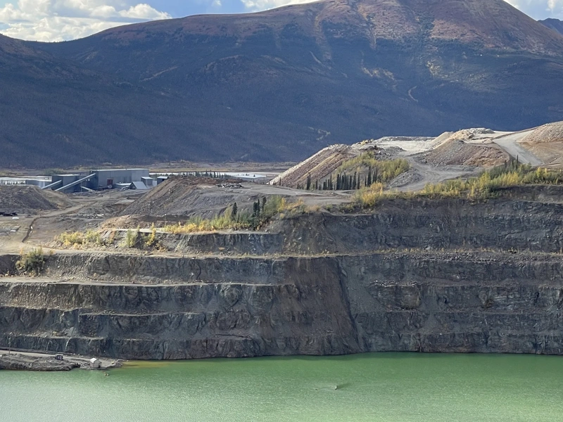 Faro Mine Remediation Project, with mountains in the back and green lake.