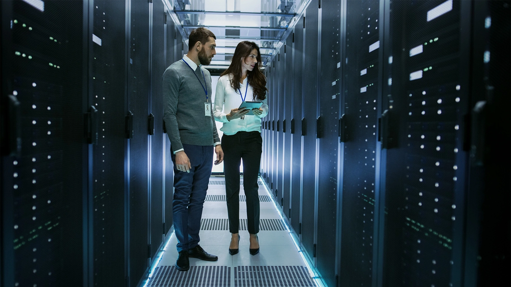 Man and women in data centre office