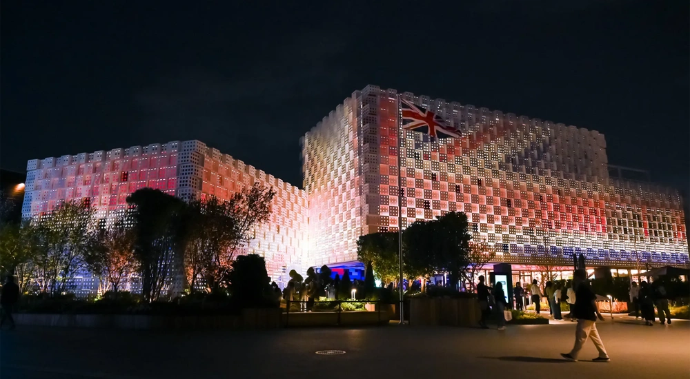 UK Pavilion at night, illuminated with UK flag lights, World Expo 2025 Osaka, Japan