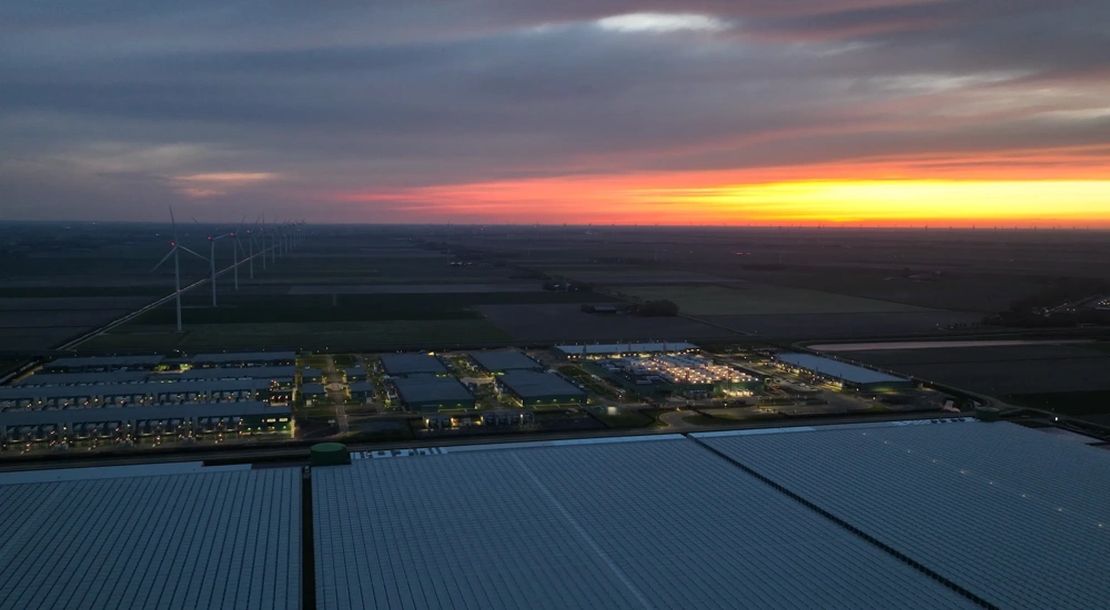 Large scale data center building complex in Middenmeer, The Netherlands, at night. Aerial view.