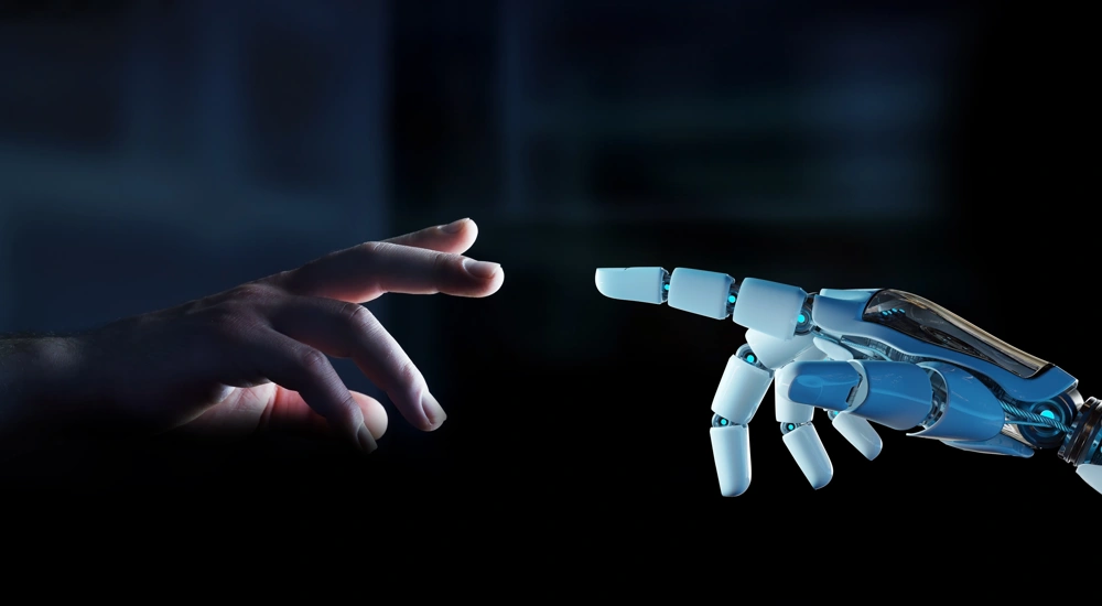 Human hand reaching out to robotic hand
