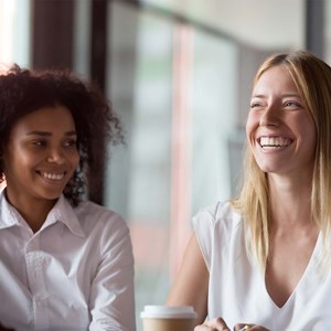 Two diverse female employees in office