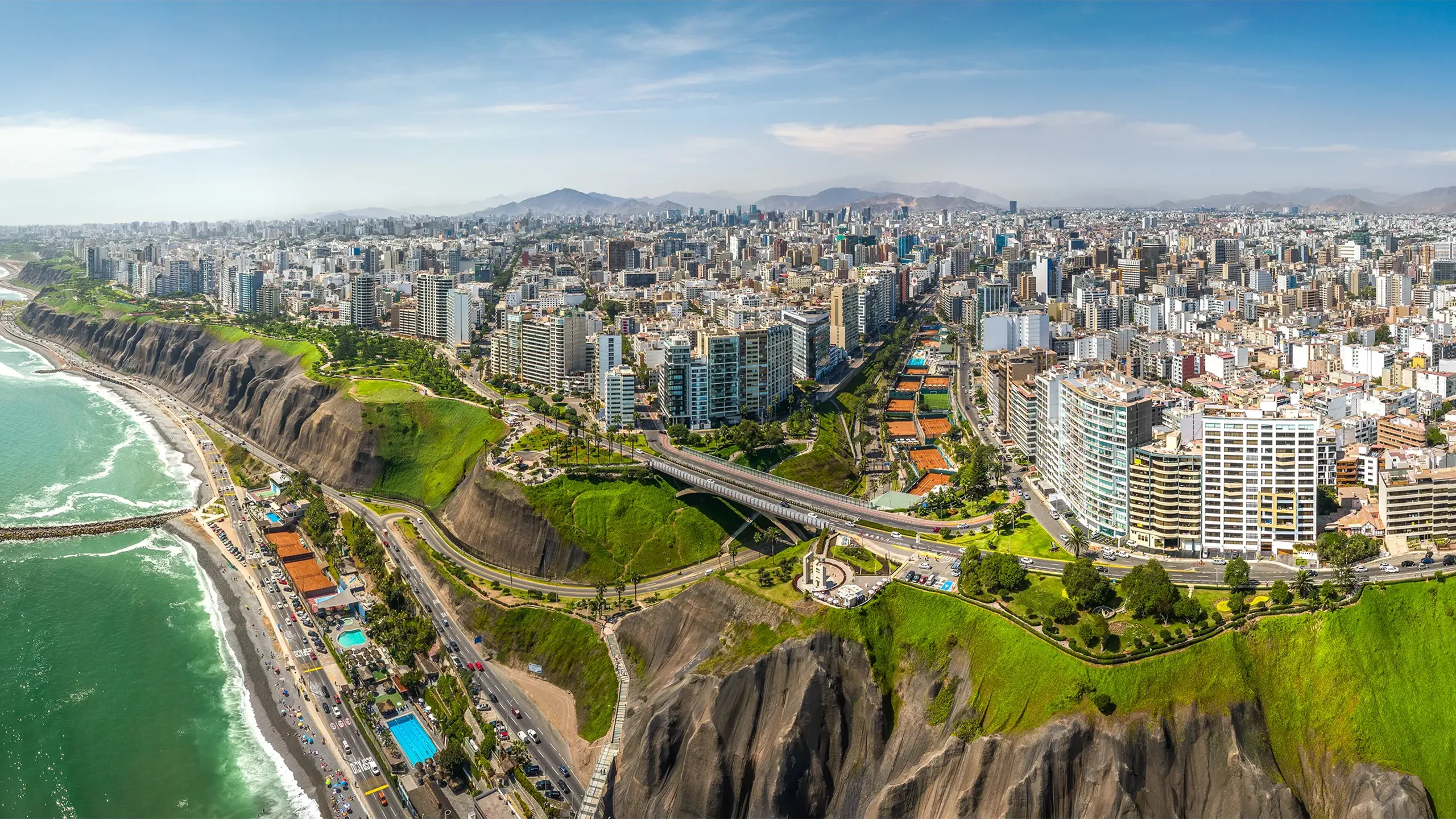 Aerial view of Miraflores town, cliff and the Costa Verde high way