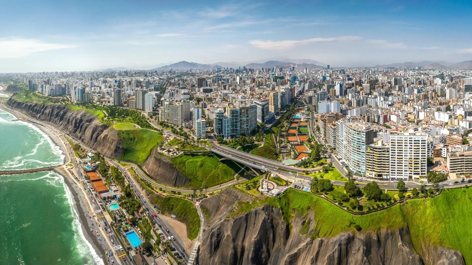 Aerial view of Miraflores town, cliff and the Costa Verde high way