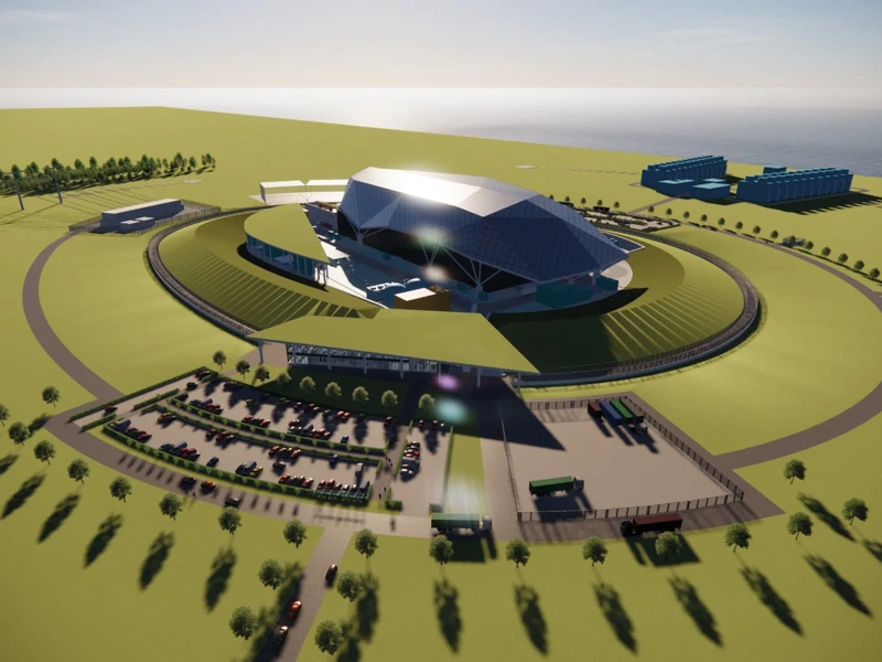 Artistic impression aerial view of a circular Rolls Royce SMR featuring a central modern building surrounded by landscaped green space.
