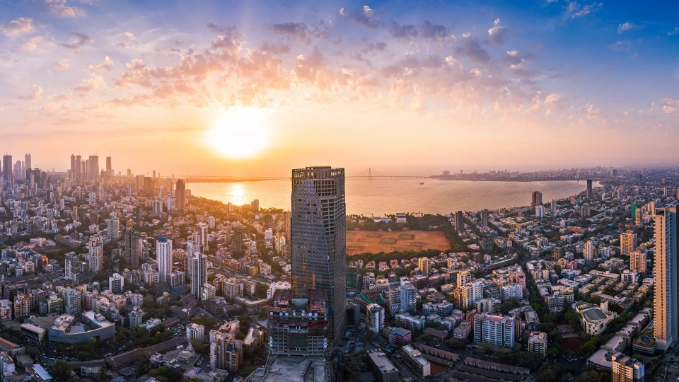 The Bandra Worli Sea Link is seen passing over the Mahim Bay, with the city around it. Dadar, Prabhadevi, Lower Parel, Worli, Matunga, Mahim and Bandra can be seen.