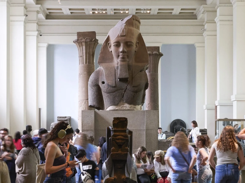 Egyptian Sculpture Gallery at the British Museum with a croud of people around it