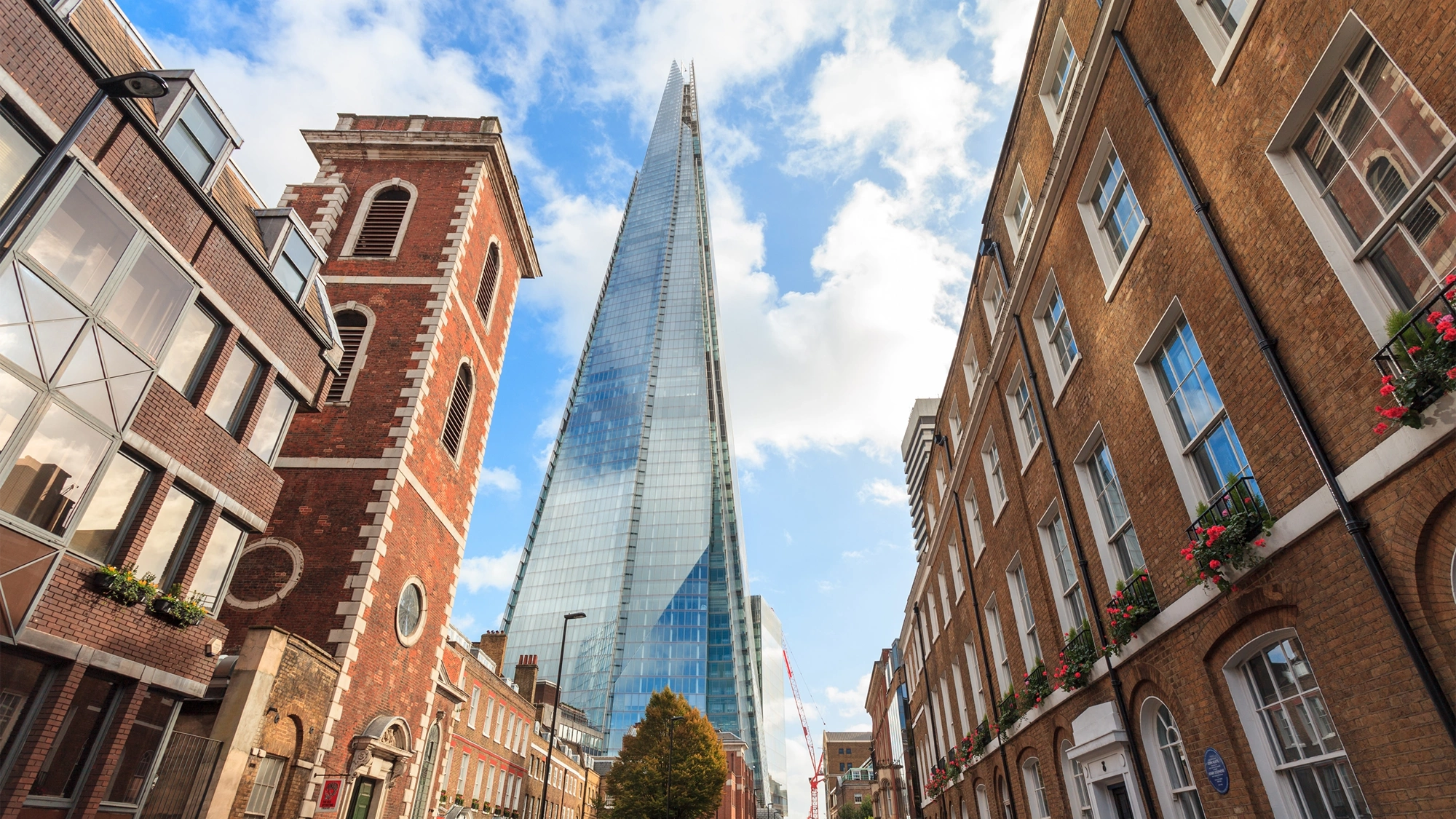 Tall brown buildings surrounding the Shard