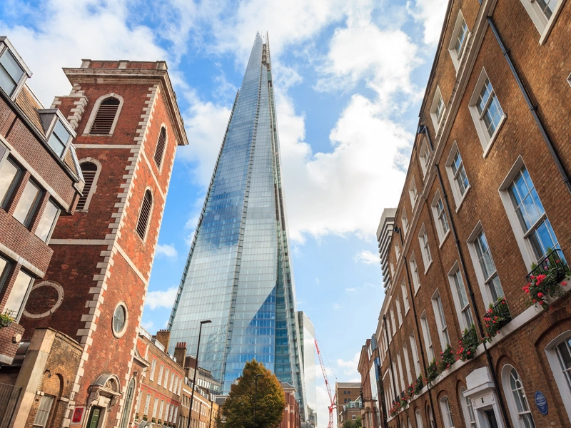 Tall brown buildings surrounding the Shard