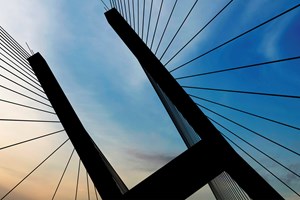 Silhouette of a suspension bridge against the sky