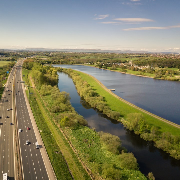 Drone view of Scotland motorway with lakeside