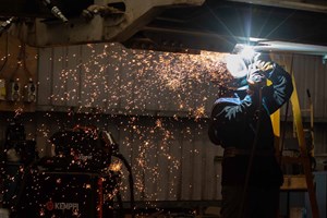 Man welding in workshop 