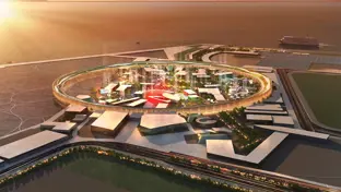 Ariel rendering of the Osaka Expo pavilion, Japan at sunset, showing a circular central structure surrounded by modern buildings and pathways within a large exhibition site.