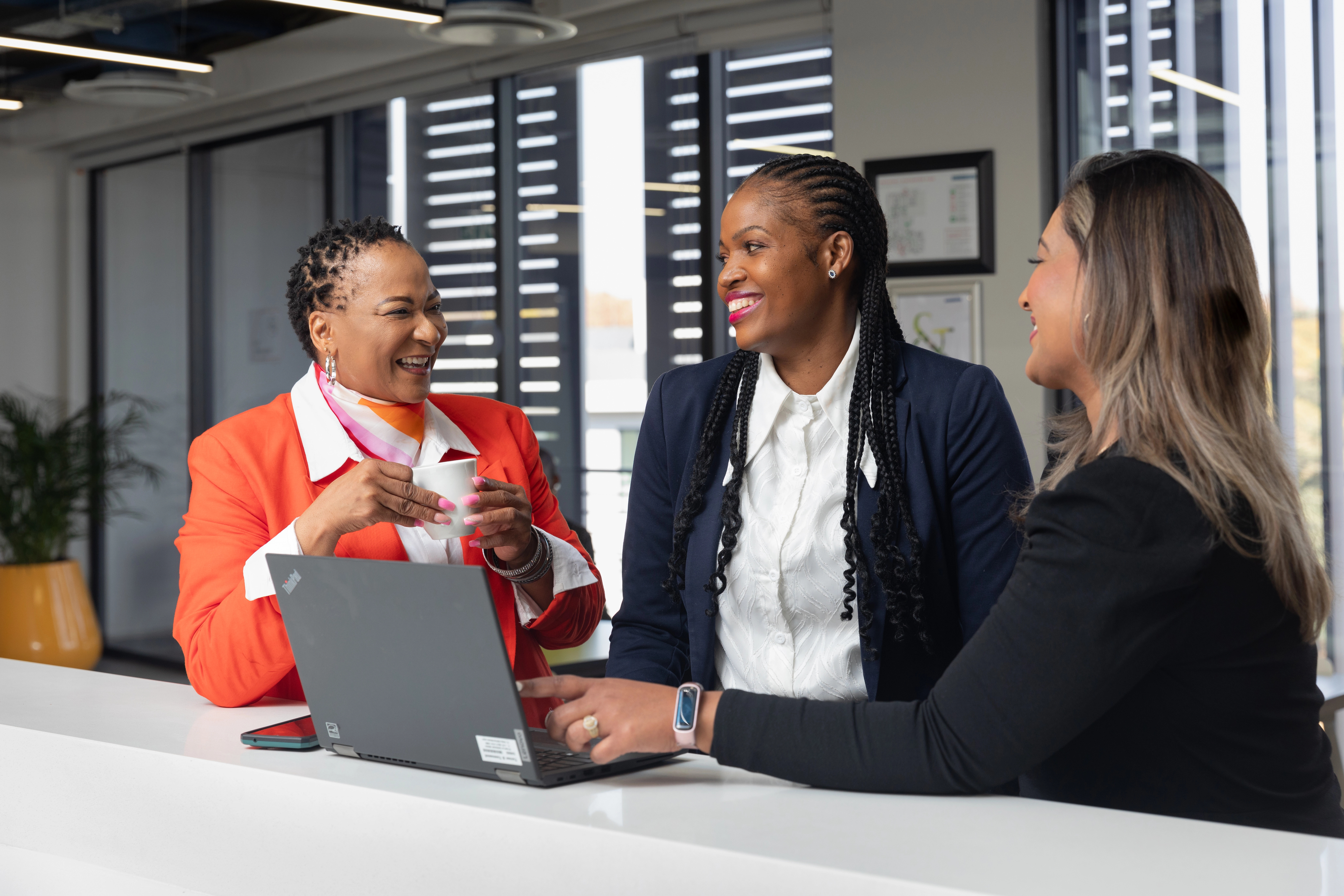 Employees conversing in an office