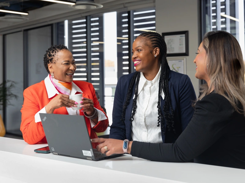 Employees conversing in an office