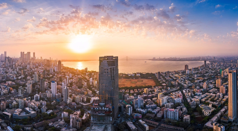 The Bandra Worli Sea Link is seen passing over the Mahim Bay, with the city around it. Dadar, Prabhadevi, Lower Parel, Worli, Matunga, Mahim and Bandra can be seen.