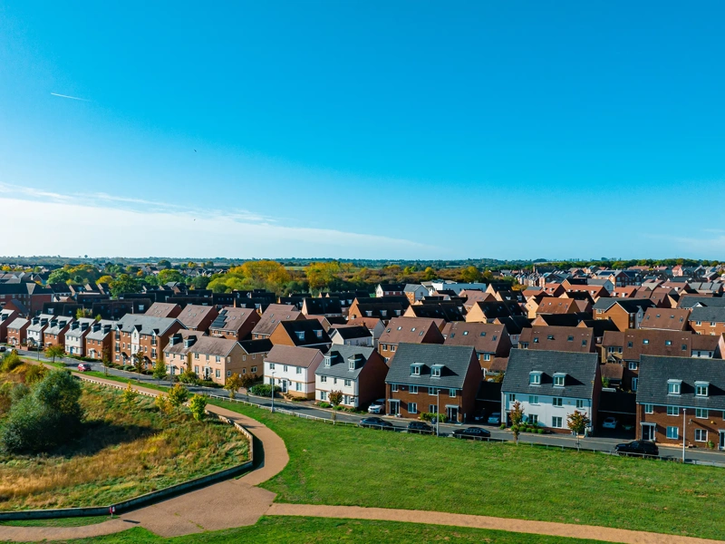 Aerial top down view of houses in England - New estate with typical British houses and green gardens - Real estate and buildings concepts in UK