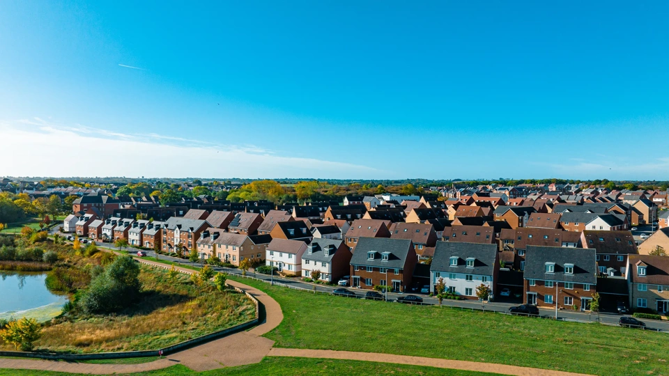 Aerial top down view of houses in England - New estate with typical British houses and green gardens - Real estate and buildings concepts in UK