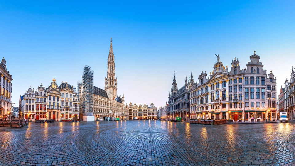 Brussels, Belgium at Grand Place with the Town Hall tower at blue hour.