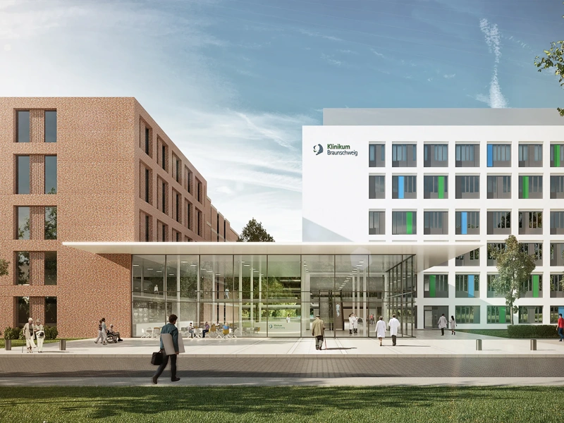 Image of Braunschweig Municipal Hospital, with blue skies and people walking by