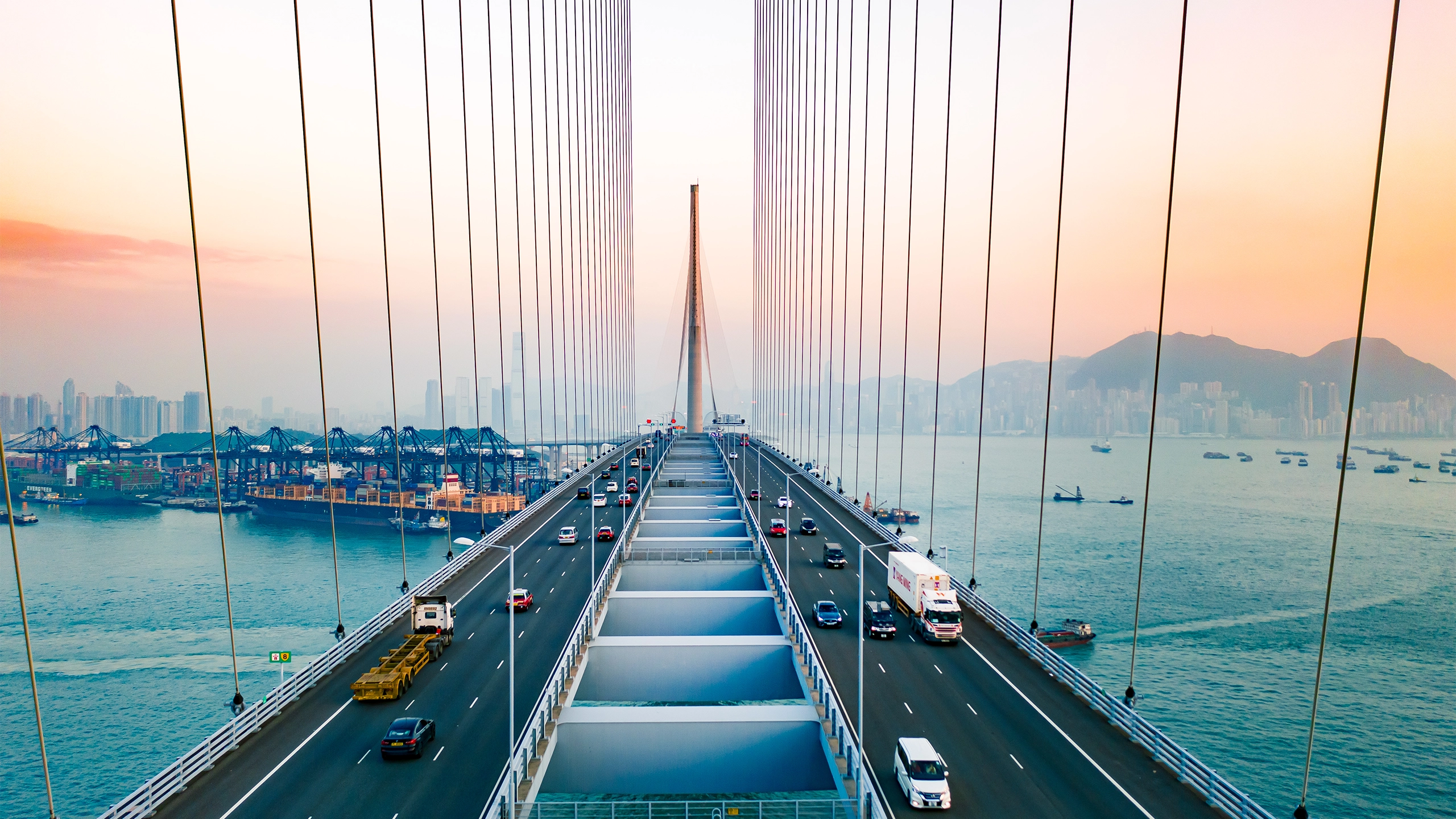 Drone view of Stonecutters Bridge and the Tsing sha highway at sunset.