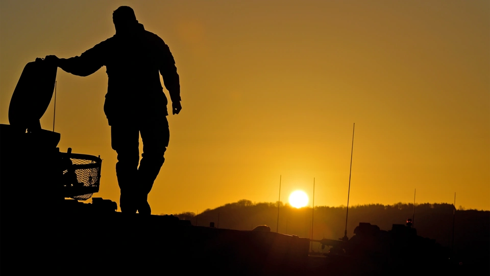 Silhouette of a person against the sun