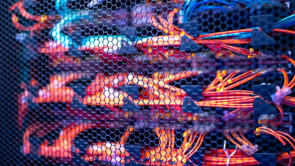 Red and orange cables in server room.