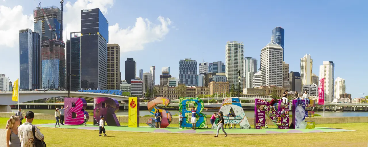 People enjoying colourful Brisbane sign at South Bank, Queensland, Australia.