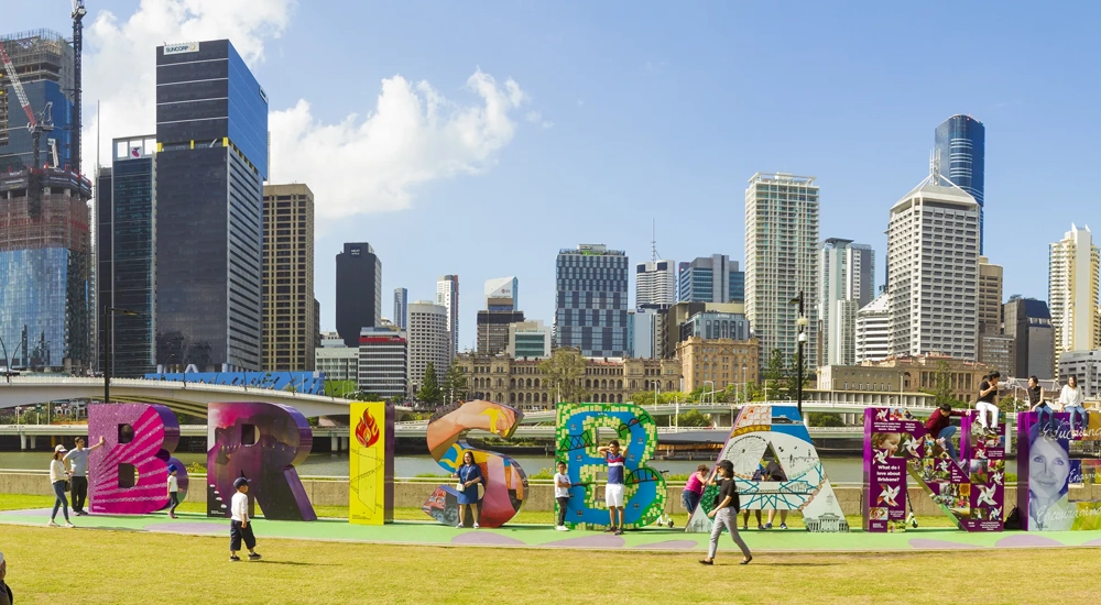 People enjoying colourful Brisbane sign at South Bank, Queensland, Australia.