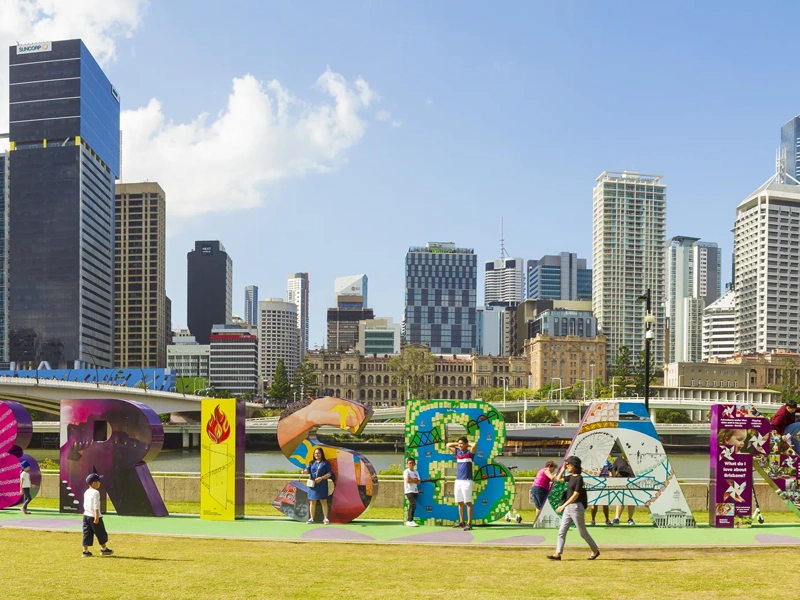 People enjoying colourful Brisbane sign at South Bank, Queensland, Australia.
