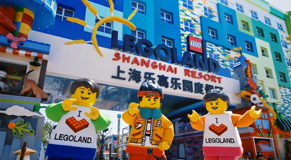 Colourful entrance to LEGOLAND Shanghai Resort with large LEGO character figures outside.