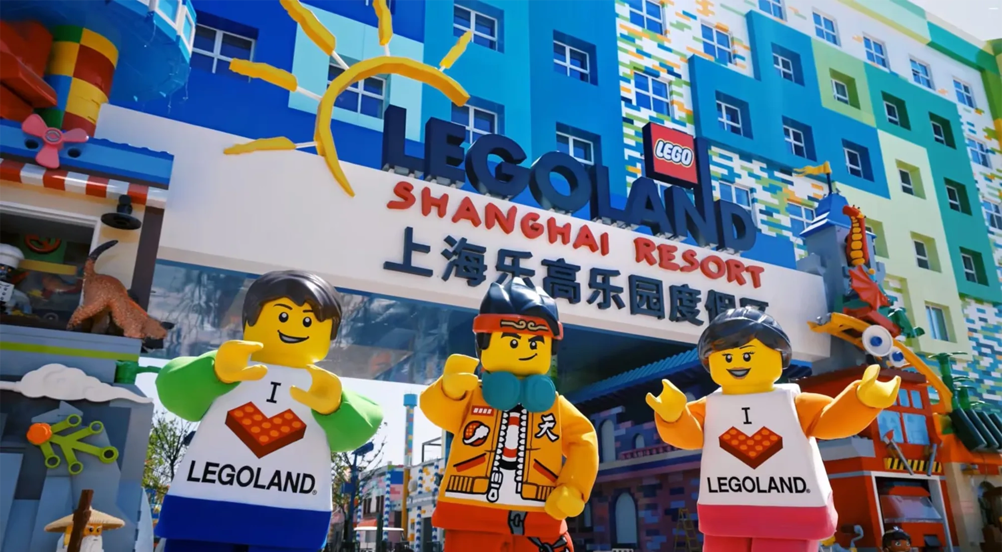 Colourful entrance to LEGOLAND Shanghai Resort with large LEGO character figures outside.