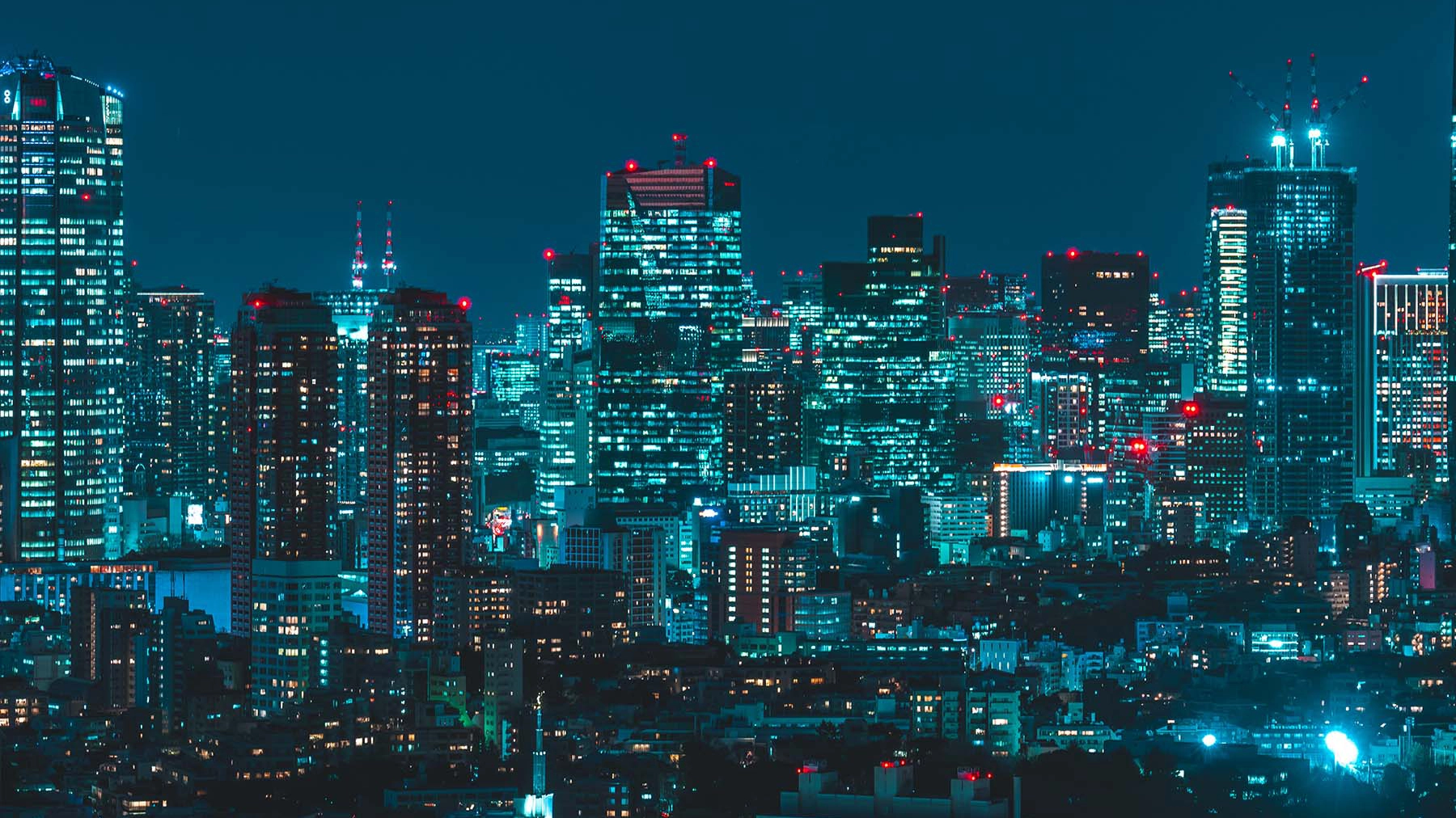 Japan skyscrapers lit up in the dark