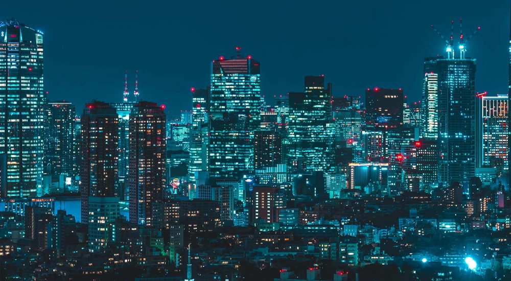 Japan skyscrapers lit up in the dark