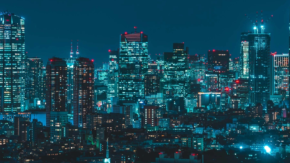 Japan skyscrapers lit up in the dark