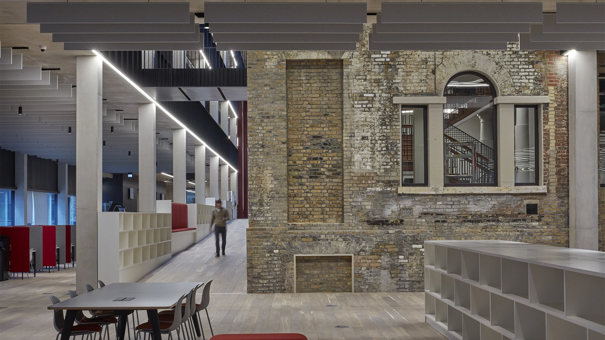 Interior shot of Tower Hamlets Town Hall with person walking down corridor.