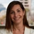 Portrait of Cinzia Gai, Senior Business Generation Manager, Germany, smiling in white blazer