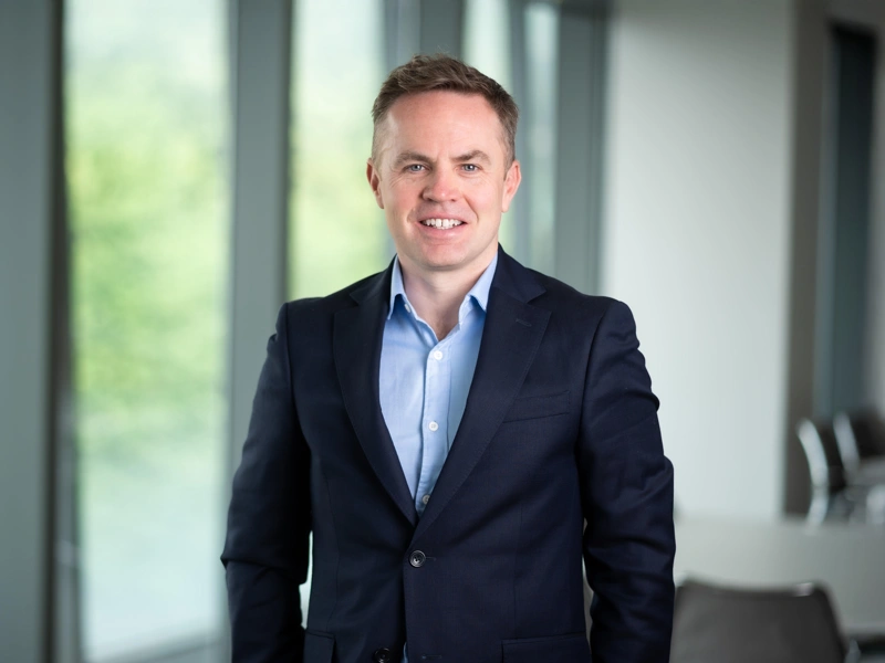 Alan Sinclair, UK Head of Energy and Natural Resources, in an office smiling in a suit