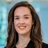 Portrait of Lisa Verhoeven, Business Generation Manager, in an office against a blue glass background