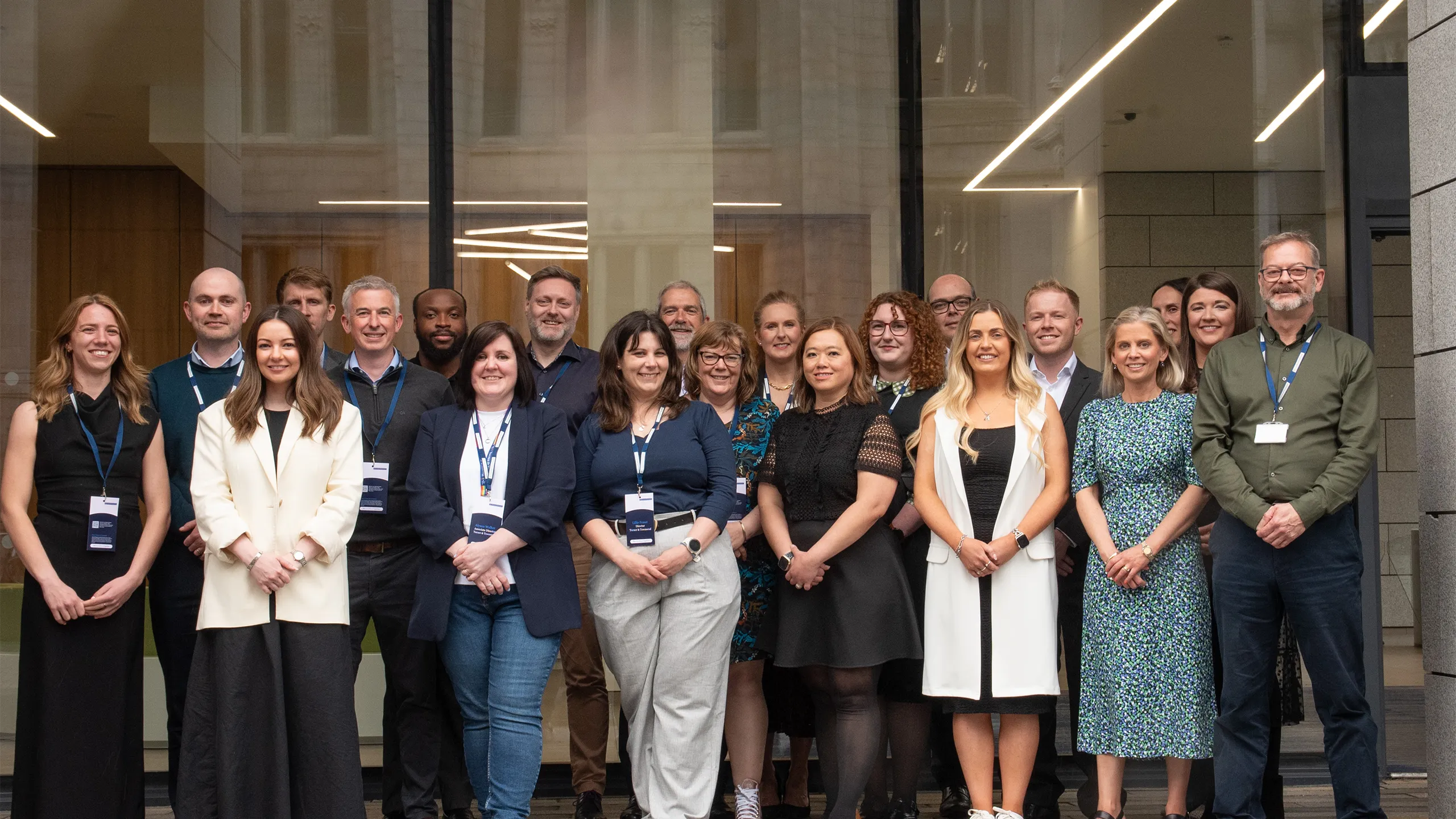 Turner & Townsend Aberdeen team outside city centre office smiling.